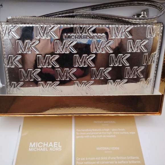 Michael Kors Handbags - Michael Kors Metallic Silver Wristlet